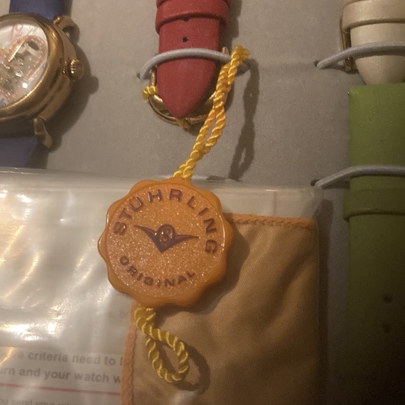 Gorgeous Stuhrling woman’s skeleton watch with several colored bands. - Picture 9 of 9